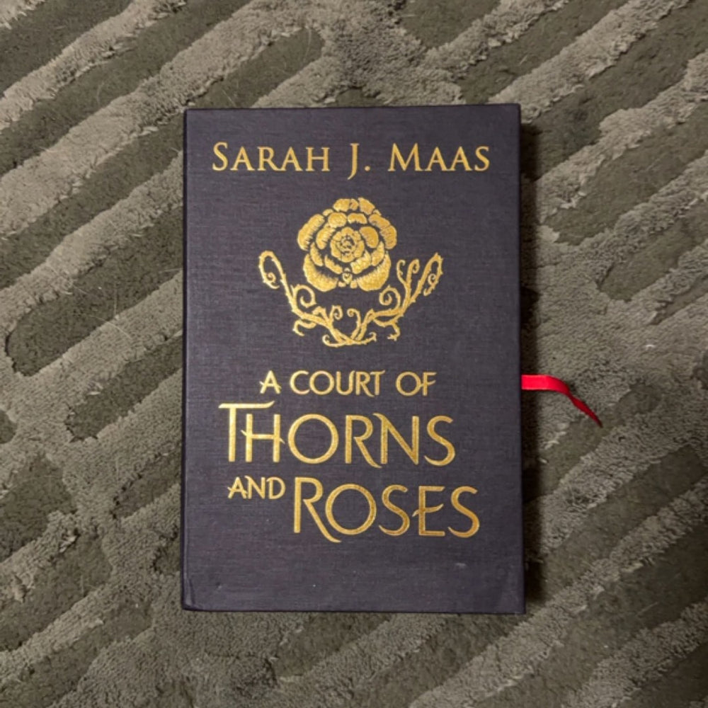 A Court of Thorns and Roses — Hardcover · New